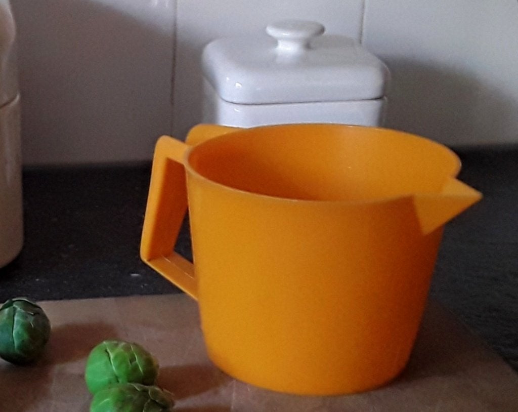 Vintage - retro oranje maatbeker - maatkan - jaren zeventig, Kunststof, Ophalen of Verzenden, Oranje, Overige typen