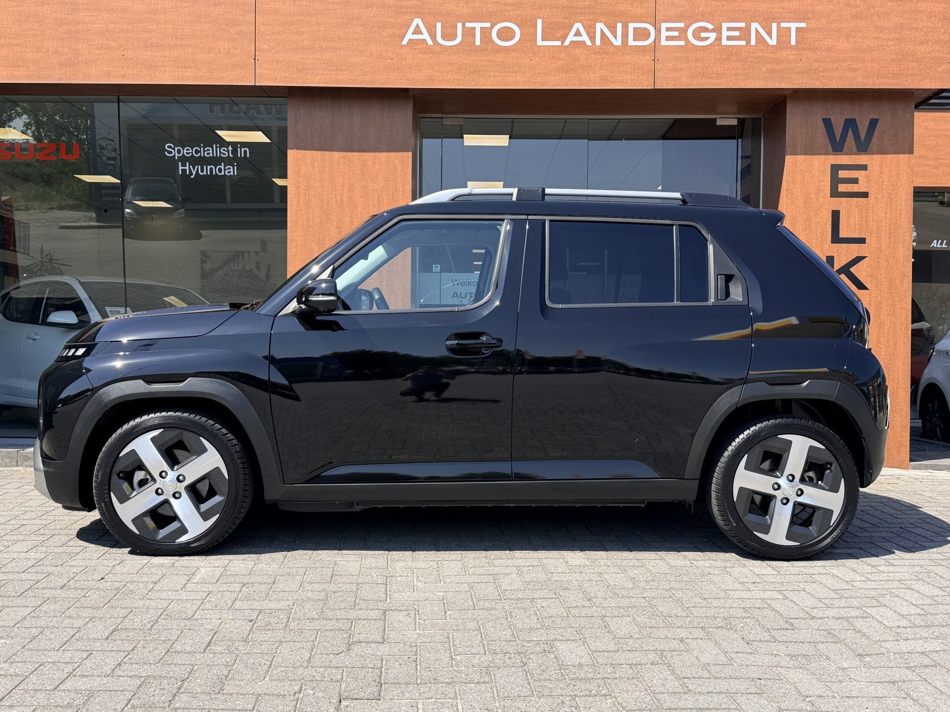 Hyundai Inster Evolve Plus 49 kWh +Winterpack | Apple/Androi, Auto's, Stof, Gebruikt, 116 pk, Zwart