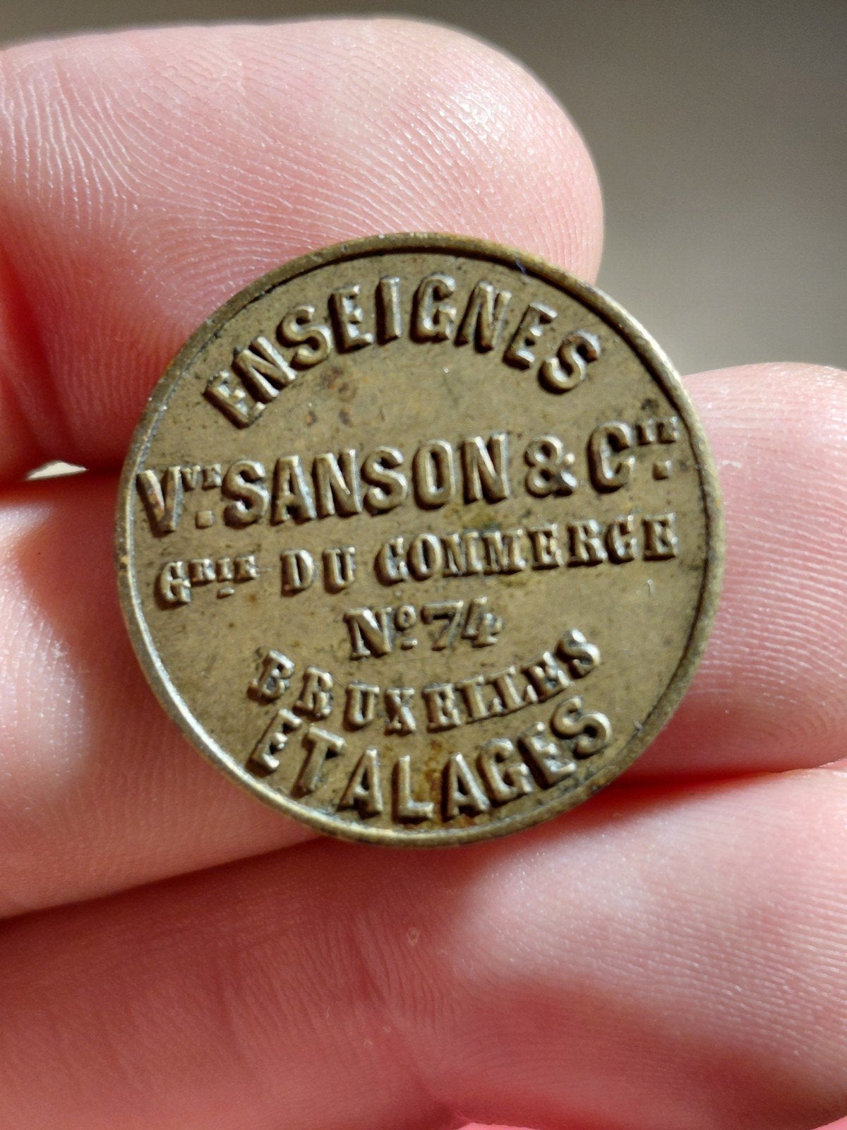 Oude Belgische munt 'Enseignes V. Sanson & C', Ophalen of Verzenden, Metaal, Losse munt