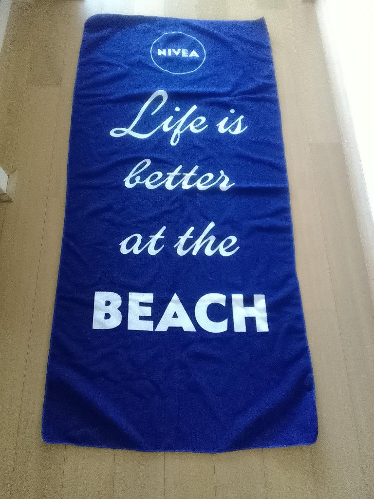Nivea strandlaken 150x70 cm nieuw, Ophalen of Verzenden, Nieuw, Blauw, Overige typen