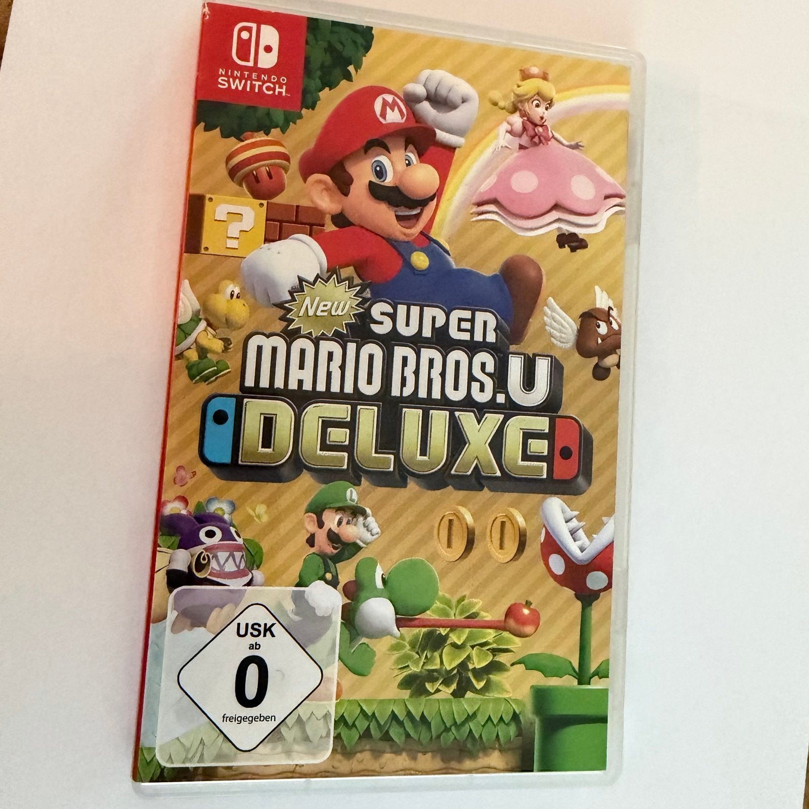 New Super Mario Bros. U Deluxe - Nintendo Switch, Spelcomputers en Games, Eén computer, Ophalen of Verzenden, Zo goed als nieuw