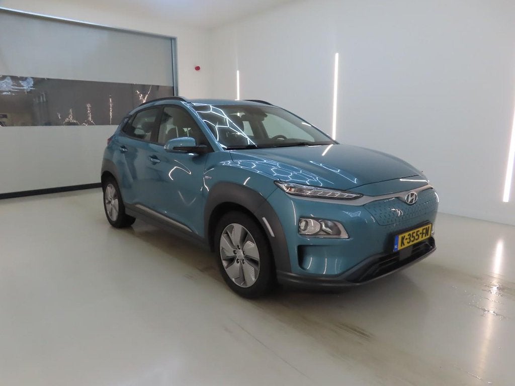 Hyundai Kona EV Comfort 64 kWh FASE 3|SOH 100%, Auto's, Dealer onderhouden, Stof, Gebruikt, Zwart