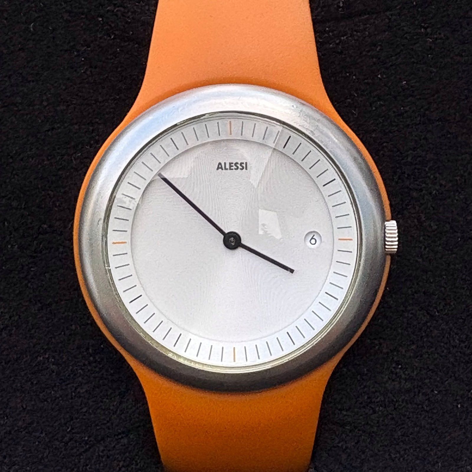 Alessi horloge Tondo AL7003 van Alberto Meda met oranje band, Overige merken, Gebruikt, Staal, Polshorloge