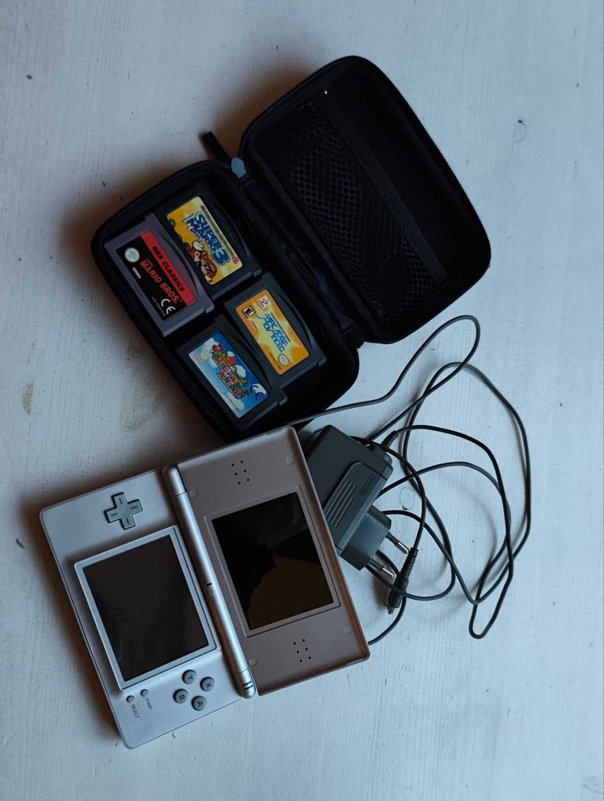 Nintendo DS Lite, 3 oude Mario Bros games en 1 arcade game, Ophalen, Met games, Zo goed als nieuw, Zilver