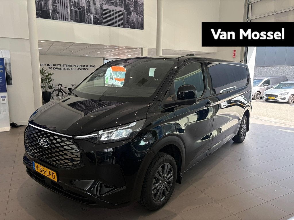 Ford E-Transit Custom 320 L2H1 Limited 65 kWh CAMERA | APPLE, Auto's, Bestelauto's, Automaat, Gebruikt, Met garantie (alle), 2192 kg