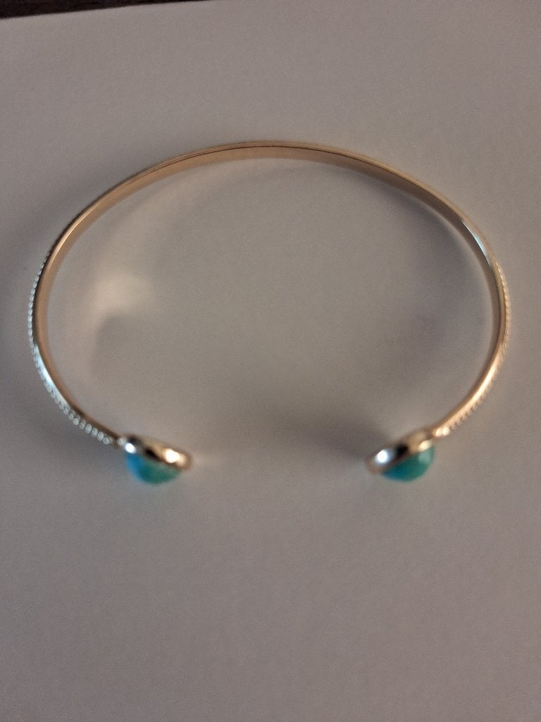 goud kleurige armband met blauwe steentjes, Ophalen of Verzenden, Nieuw, Goud, Zilver