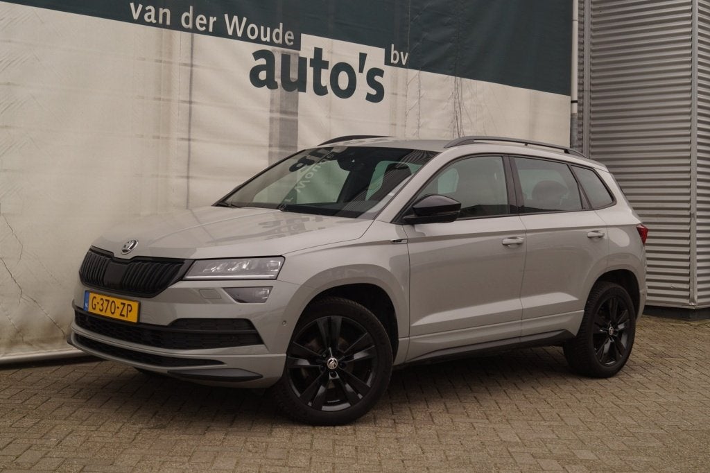 Skoda Karoq 1.5 TSI 150pk DSG Sportline Business -LEER-ECC-, Auto's, Dealer onderhouden, 4 cilinders, 150 pk, Bedrijf