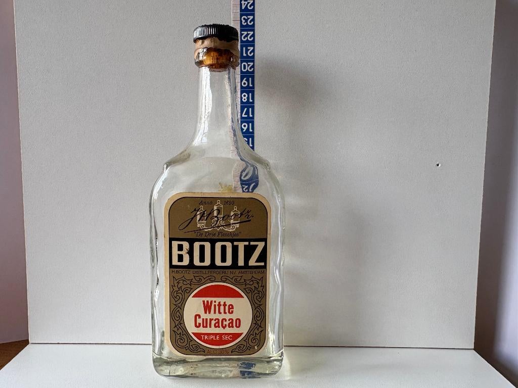 Lege oude fles van Bootz Witte Curacao Triple Sec likeur, Verzamelen, Ophalen of Verzenden, Gebruikt, Verpakking