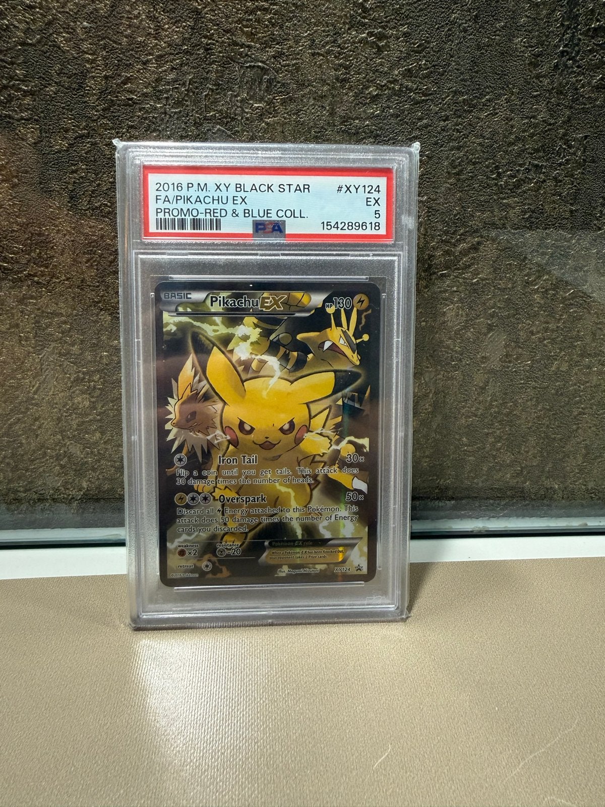 PSA 5 Pikachu EX XY124 Promo Pokémon Kaart, Ophalen of Verzenden, Zo goed als nieuw, Losse kaart