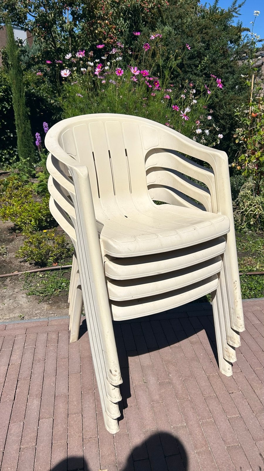 Set van 4 stapelbare kunststof tuinstoelen, Tuin en Terras, Ophalen, Gebruikt, Kunststof, Stapelbaar