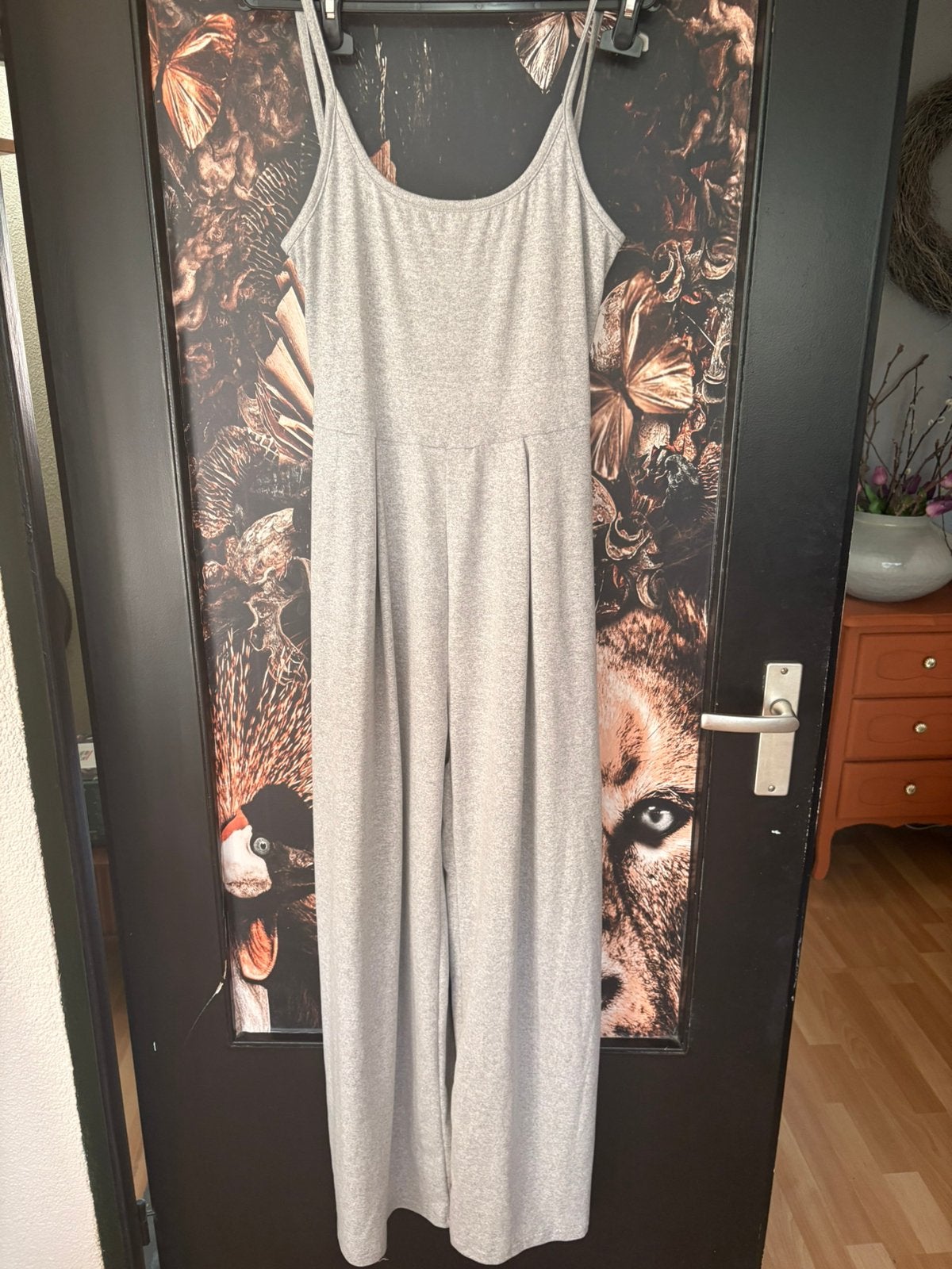 Toffe grijze jumpsuit met open rug en wijde pijp mt L ZGAN, Ophalen of Verzenden, Zo goed als nieuw, Maat 42/44 (L), Grijs