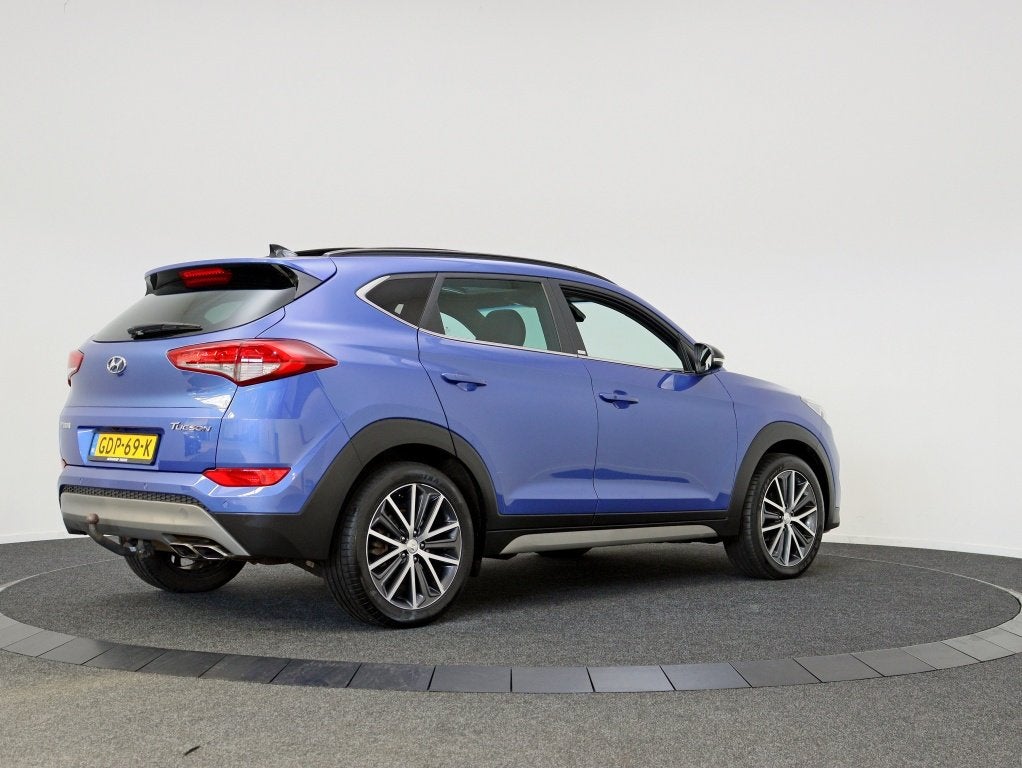 Hyundai Tucson 1.6 T-GDi 4WD Comfort Plus Automaat | Pano |, Stof, Gebruikt, 4 cilinders, Blauw