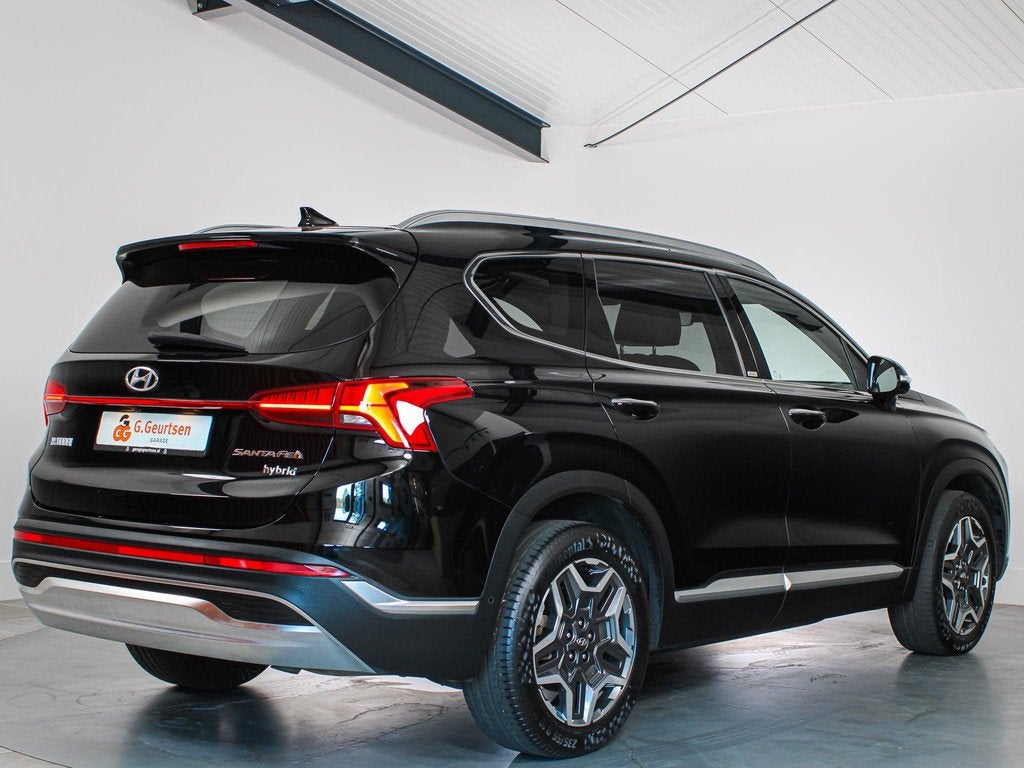 Hyundai Santa Fe 1.6 T-GDI HEV Premium Sky 7-Persoons Panora, Auto's, Hyundai, Santa Fe, Gebruikt, 4 cilinders, Leder