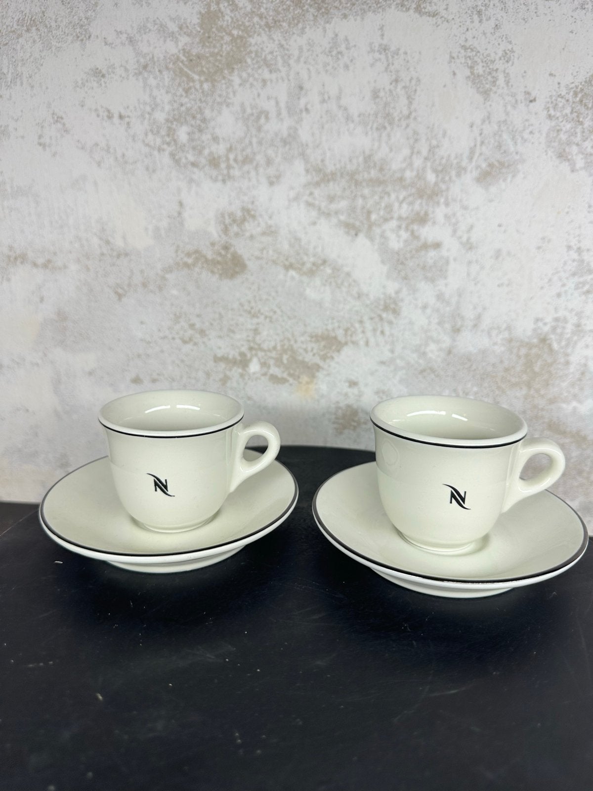 Nespresso espresso kop en schotel set van 2, Gebruikt, Overige merken, Keramiek, Ophalen of Verzenden