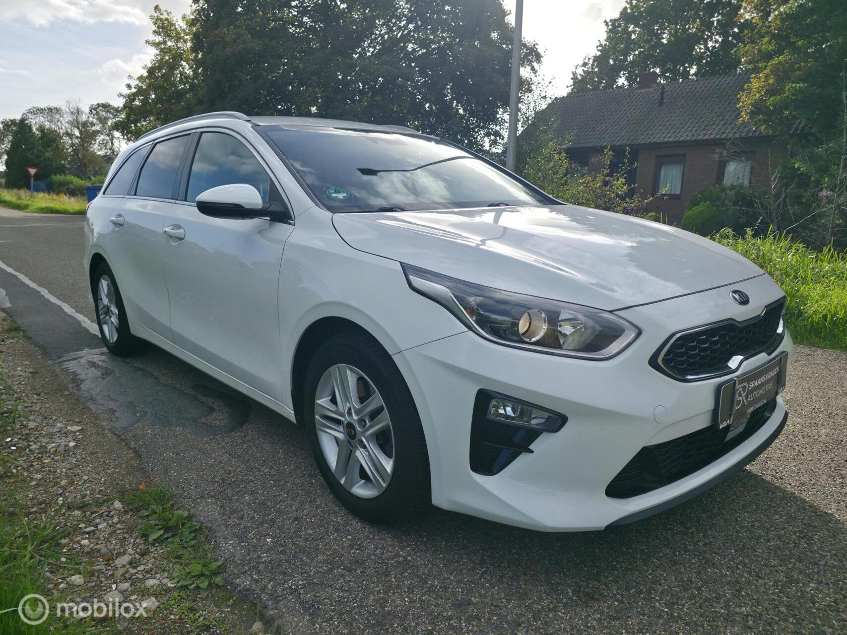 Kia Ceed Sportswagon 1.0 T-GDi / Trekh / Navi / Half leder, Voorwielaandrijving, Dealer onderhouden, Leder en Stof, Wit