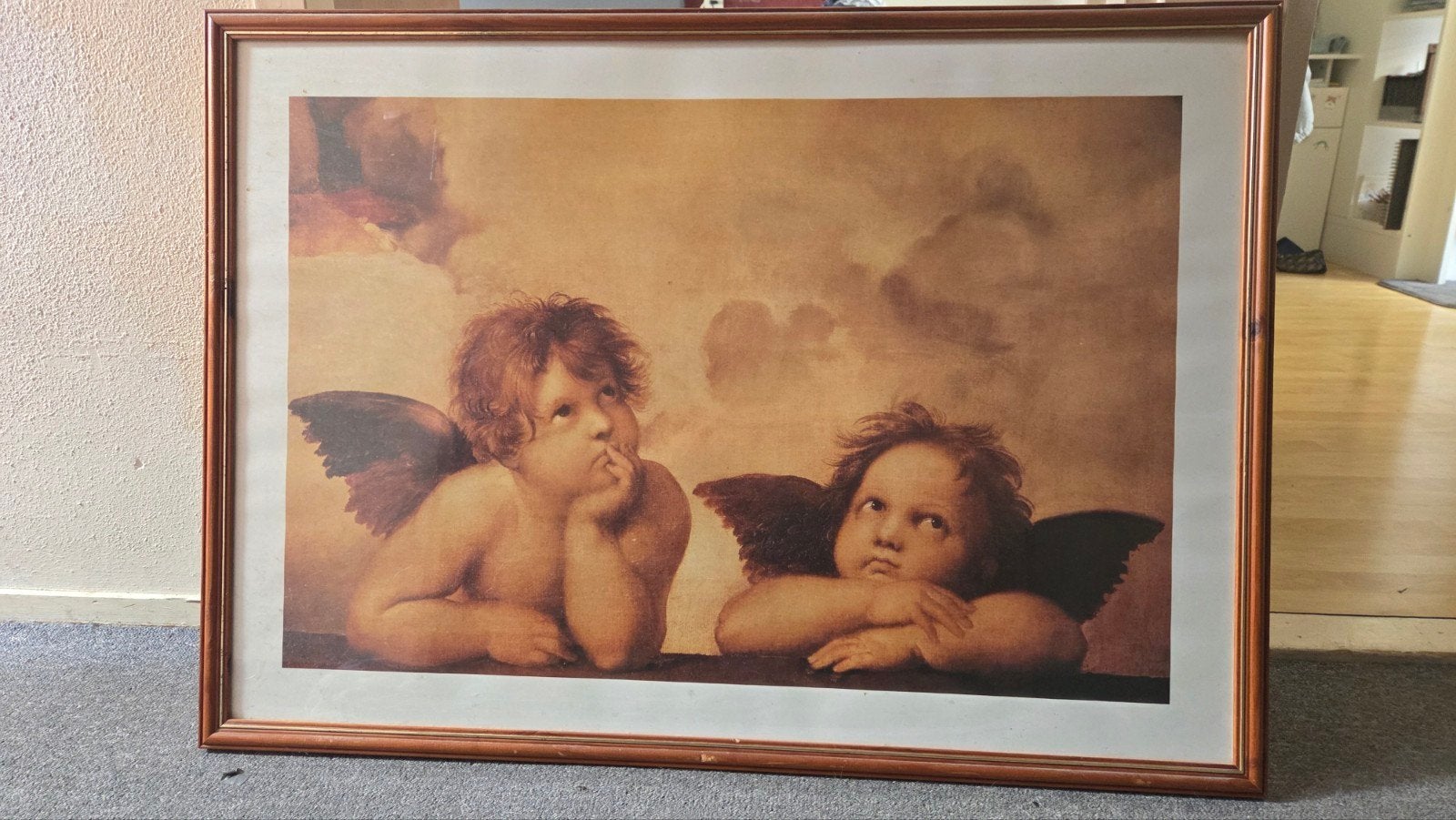 Ingelijste reproductie van Rafaëls Putti, Ophalen