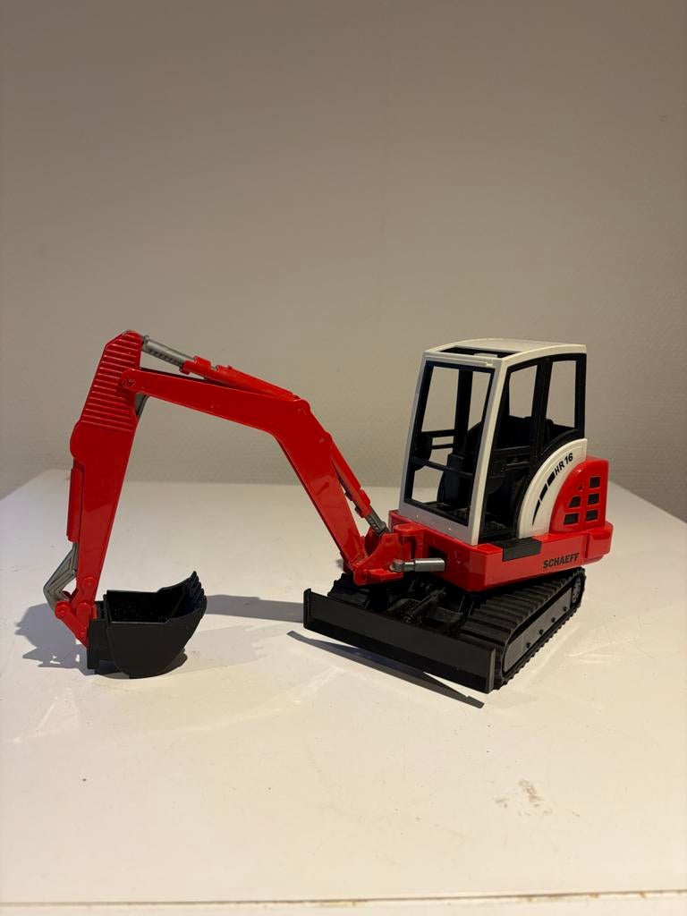 Bruder Schaeff HR16 Mini Graafmachine Speelgoedmodel, Ophalen of Verzenden, Zo goed als nieuw