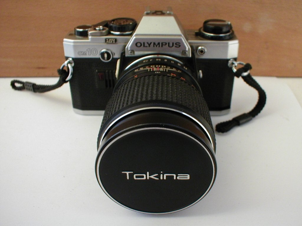 Olympus OM10 met Tokina 135mm F/2.8, Audio, Tv en Foto, Fotocamera's Analoog, Ophalen of Verzenden, Gebruikt, Spiegelreflex, Olympus