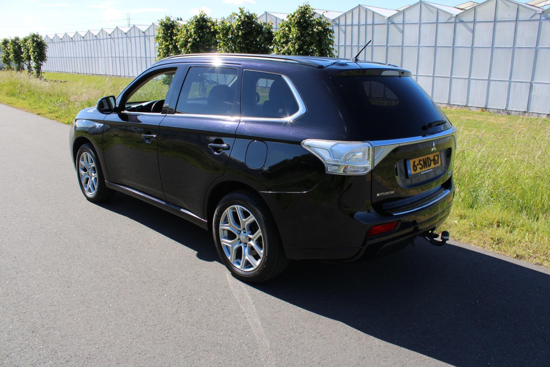 Mitsubishi Outlander 2.0 PHEV Intense + Automaat 4x4, Auto's, 4 cilinders, Leder en Stof, Zwart, Automatische klimaatregeling