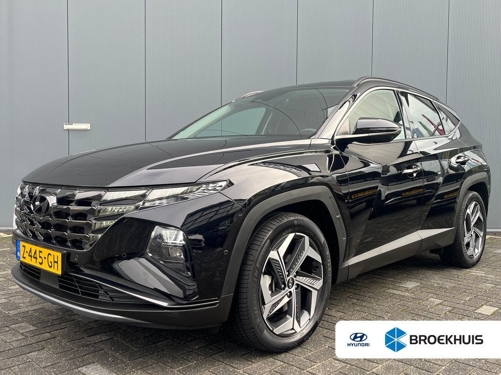 Hyundai Tucson 1.6 T-GDI 265pk PHEV Premium 4WD, Gebruikt, 4 cilinders, Zwart, Bedrijf