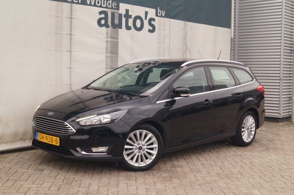 Ford Focus Wagon 1.0 125pk Titanium -NAVI-ECC-PDC-CAM-TREKHA, Gebruikt, Euro 6, Zwart, Origineel Nederlands