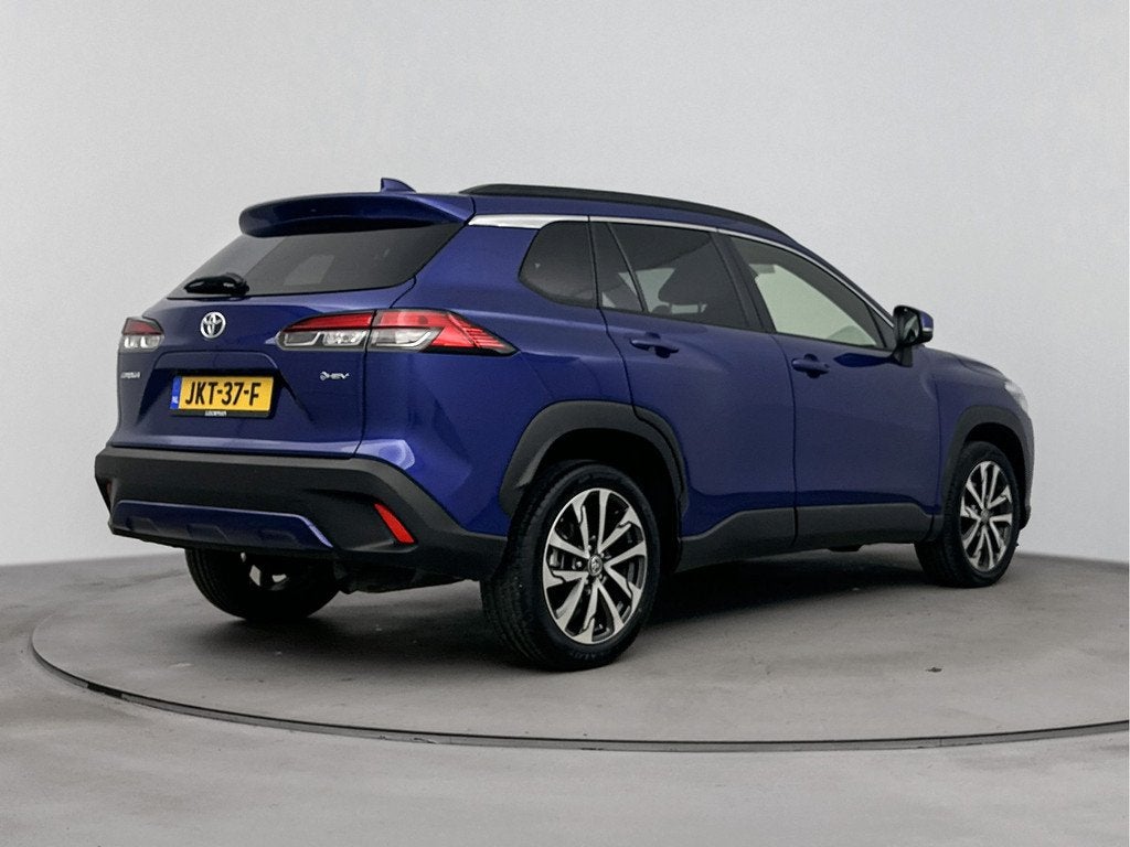 Toyota Corolla Cross Hybrid 140 Style Luxury | Stuur-/stoelv, Auto's, Toyota, Gebruikt, 4 cilinders, Blauw, Leder en Stof