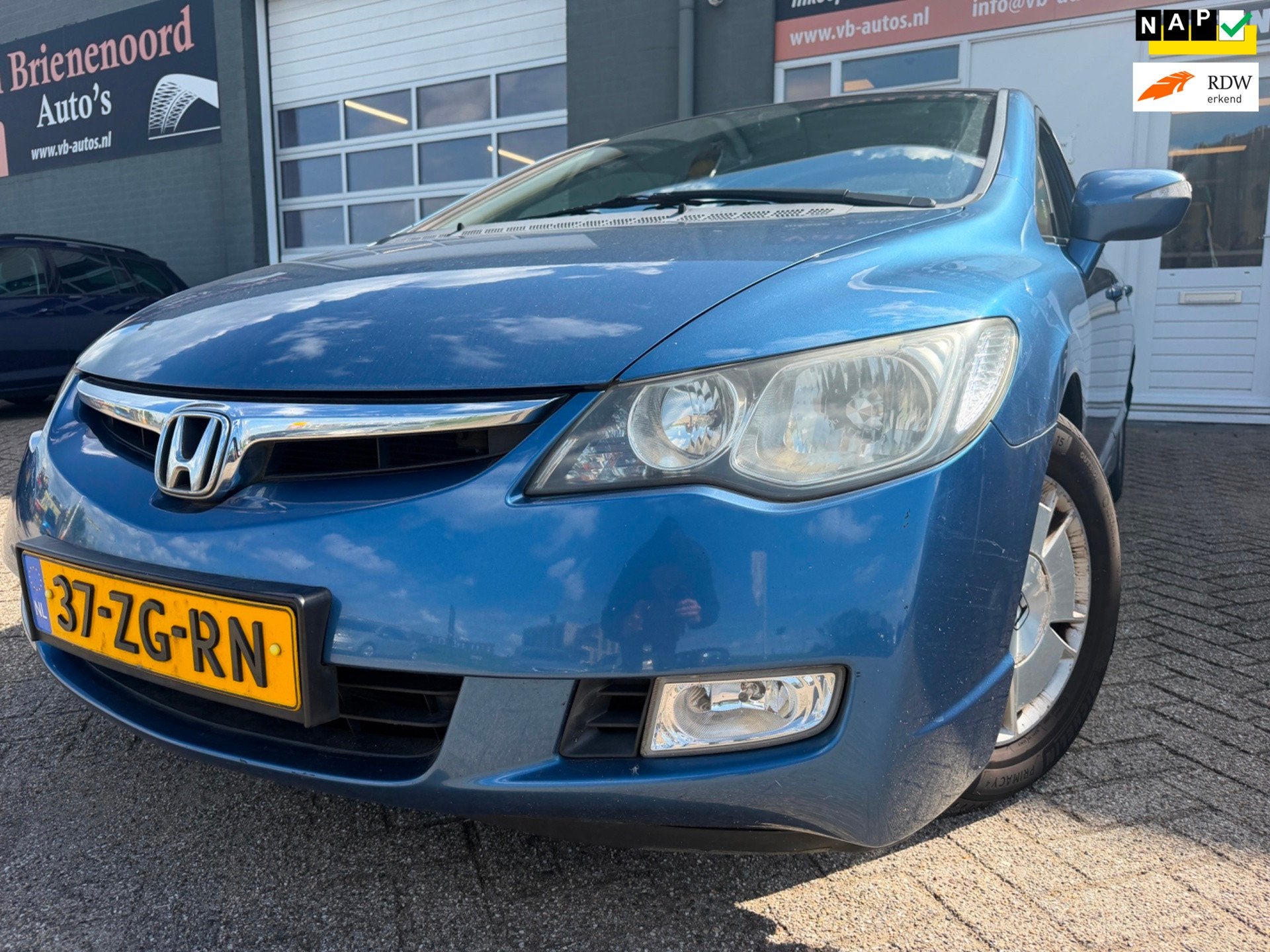 Honda Civic 1.3 Hybrid Comfort in automaat met cruise contro, Auto's, Stof, Gebruikt, Zwart, Blauw