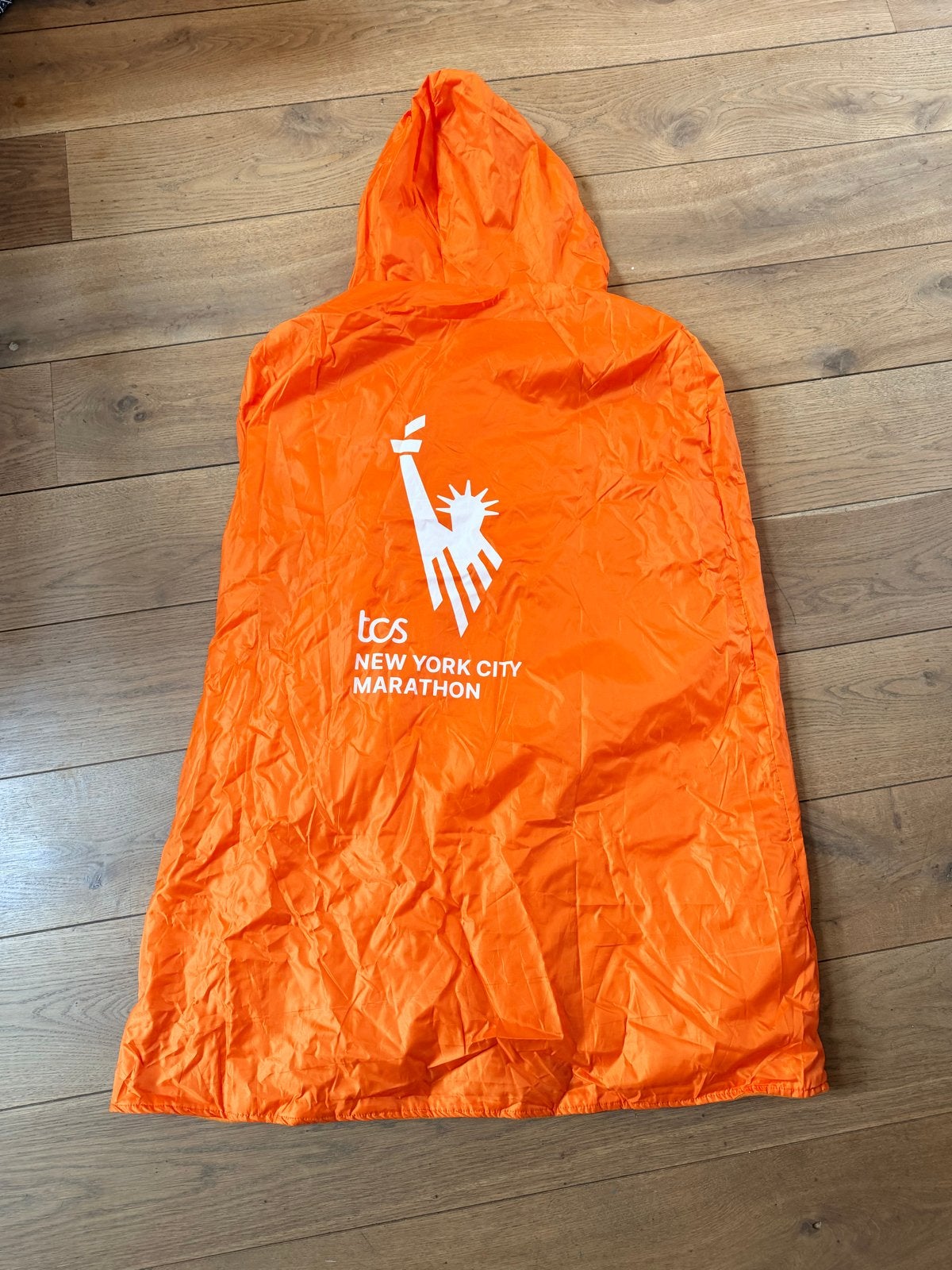 TCS New York City Marathon poncho 2023, Ophalen of Verzenden, Zo goed als nieuw, Oranje, Overige typen