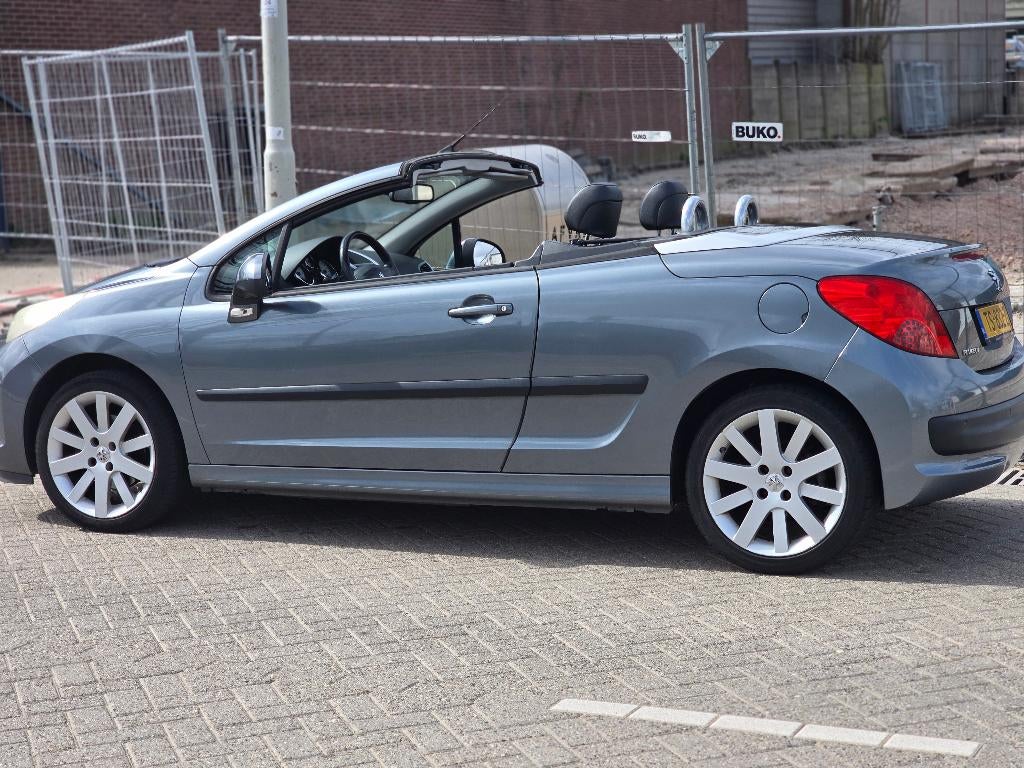 Peugeot 207 1.6 16V CC 88KW 2007 Grijs, Auto's, Voorwielaandrijving, 15 km/l, Zwart, 4 cilinders