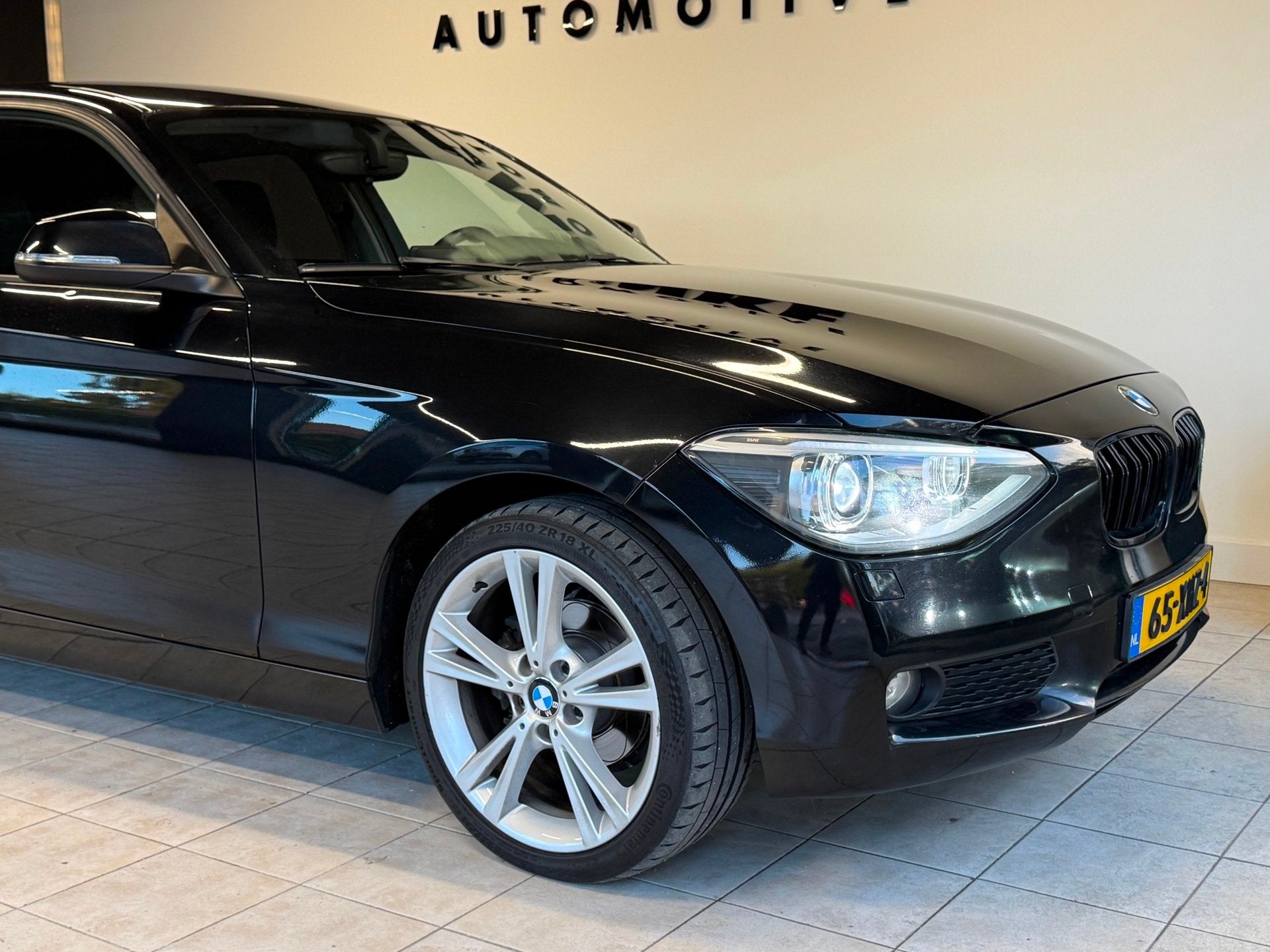 Foto 16 van BMW 1-serie 116D Business 2012 Zwart AIRCO|NAVI|XENON|NAP!