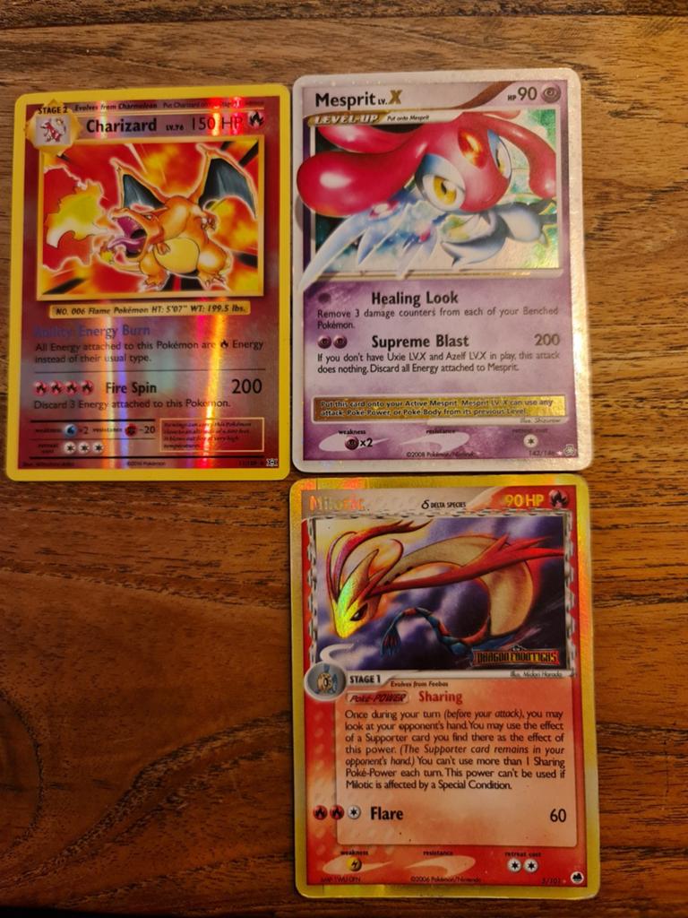 3 pokemon kaarten tekoop charizard/ mesprit/ milotic, Ophalen of Verzenden, Gebruikt, Meerdere kaarten