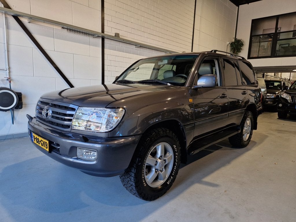 Toyota LandCruiser 100 4.2 Executive Grijs Kenteken, Auto's, Automaat, Gebruikt, Stoelverwarming, 4164 cc