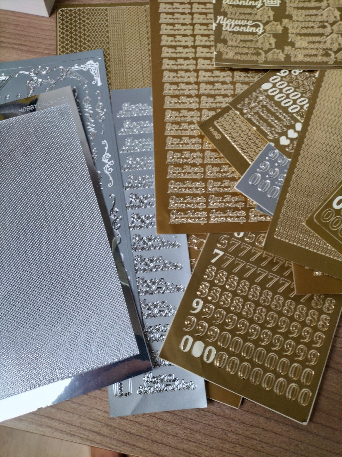 Diverse sticker vellen cijfers & teksten zilver/goud, Ophalen