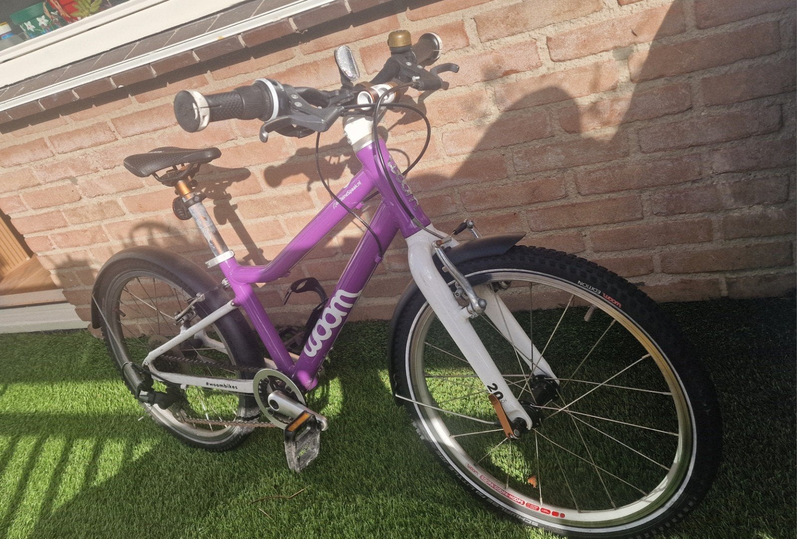 Woom 4 Paarse Kinderfiets, Ophalen, 20 inch of meer, Gebruikt, Velgrem