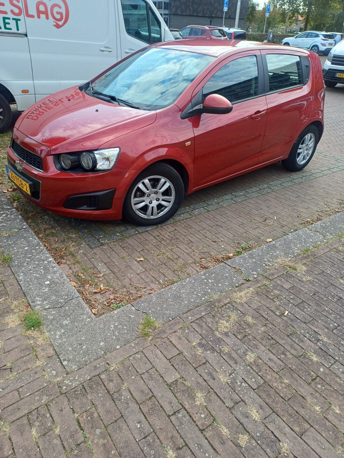 Chevrolet Aveo 1.2 5-DEURS 2012 Rood, Auto's, Voorwielaandrijving, Stof, 40 €/maand, Aveo
