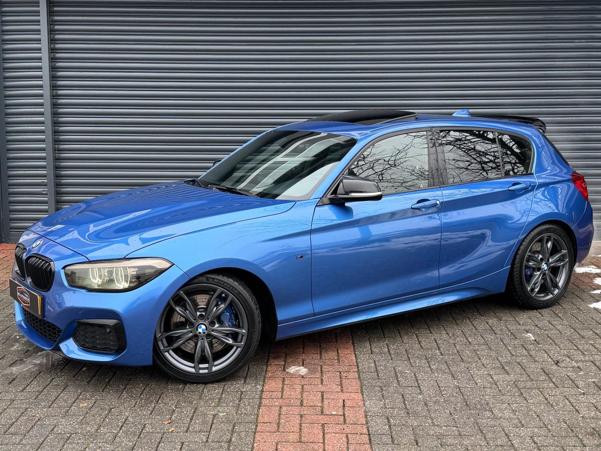 BMW 1-serie M140i High Executive Dak | Rwd | Alcantara | Tar, Auto's, Achterwielaandrijving, Gebruikt, Blauw, Alcantara