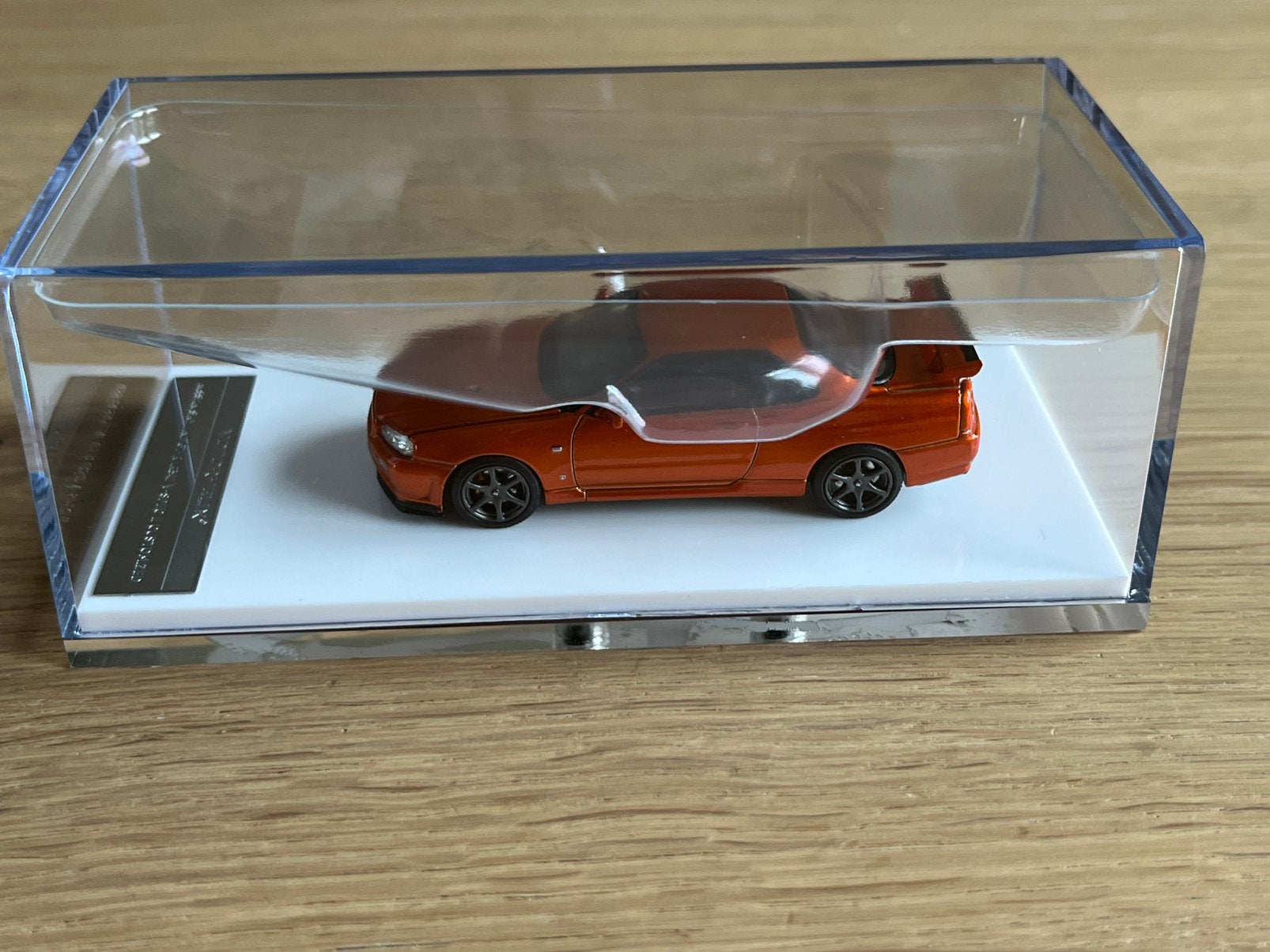 1:64 Motorhelix Nissan Skyline GT-R (R34) oranje, Ophalen of Verzenden, Nieuw, Auto