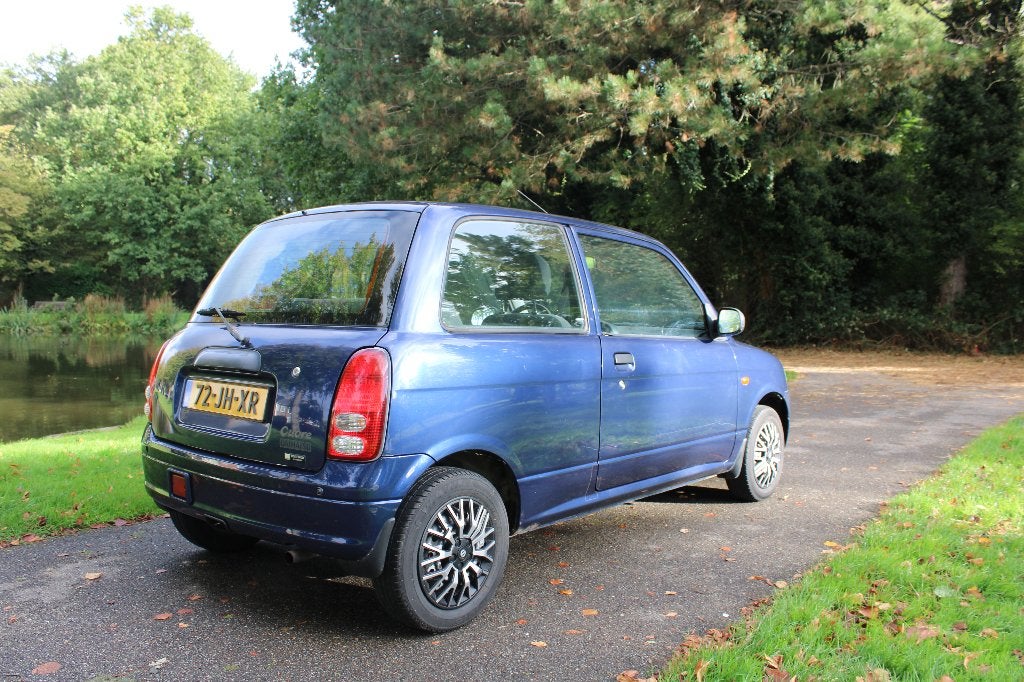 Daihatsu Cuore 1.0 AUTOMAAT 2002 Blauw, Auto's, 600 kg, Cuore, Origineel Nederlands, Grijs