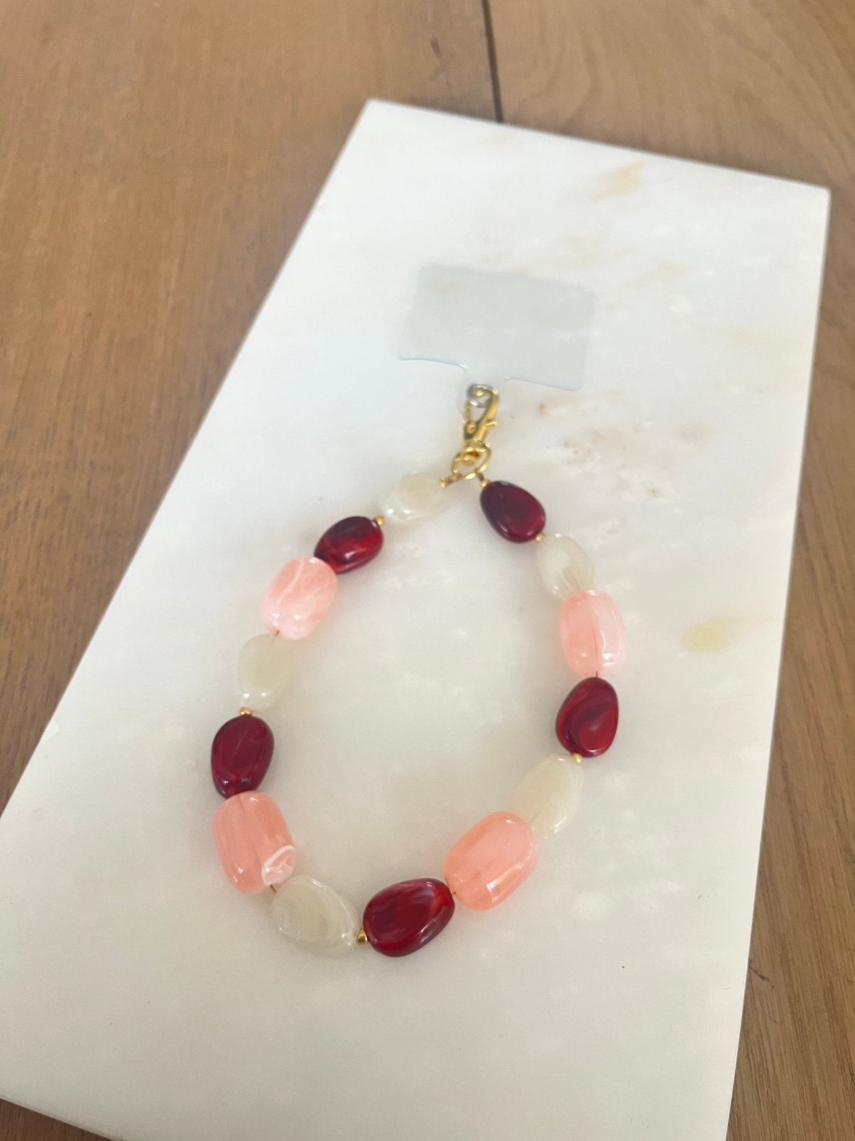 Telefoonkoord / sleutelhanger / bagcharm(goud,roze,rood,wit), Ophalen of Verzenden, Zo goed als nieuw