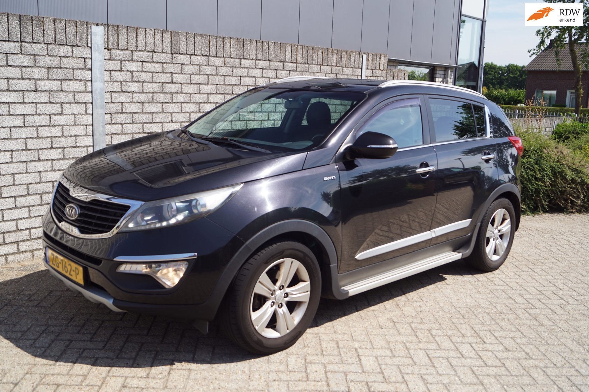 Kia Sportage 2.0 Plus Pack AWD Autom Sportst Stoelverw A Ban, Auto's, Kia, Automaat, Stof, Gebruikt, Zwart