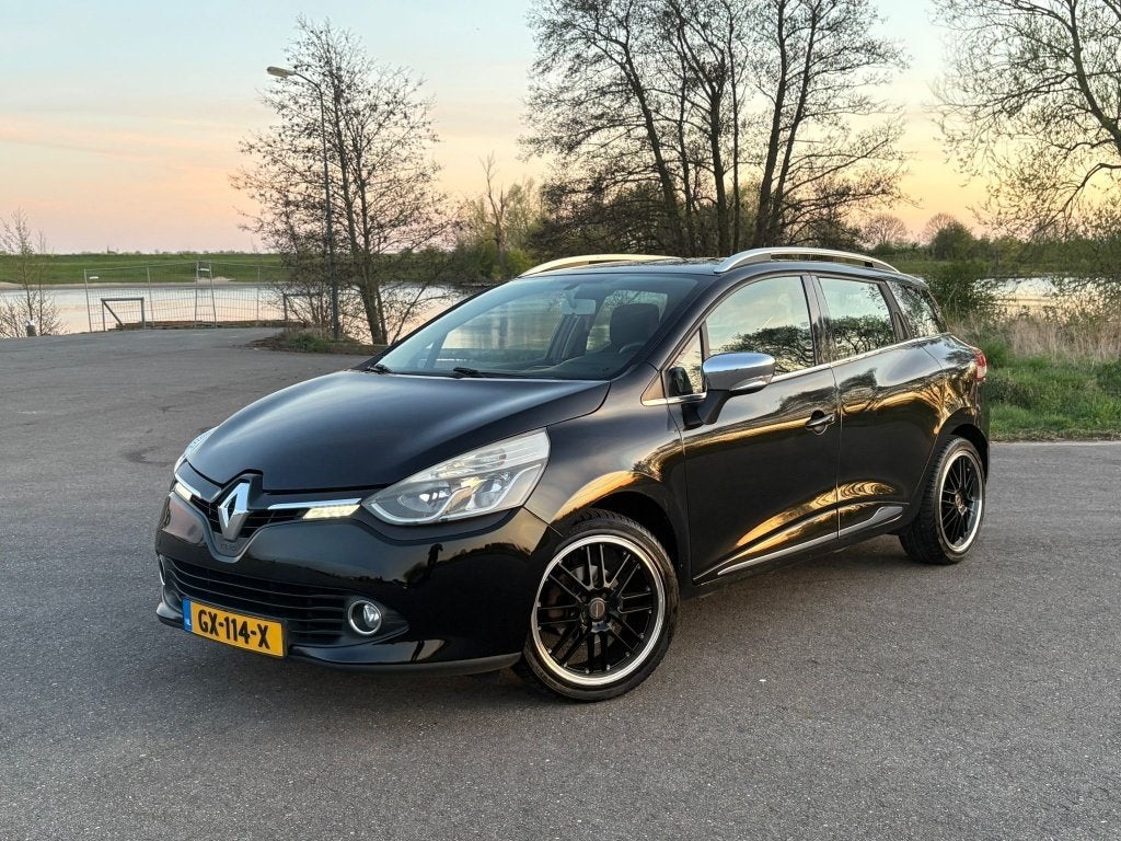 Renault Clio Estate 1.2 DISTRIBUTIE V.V. Navi Airco Cruise C, Auto's, Voorwielaandrijving, Zwart, 4 cilinders, Leder en Stof