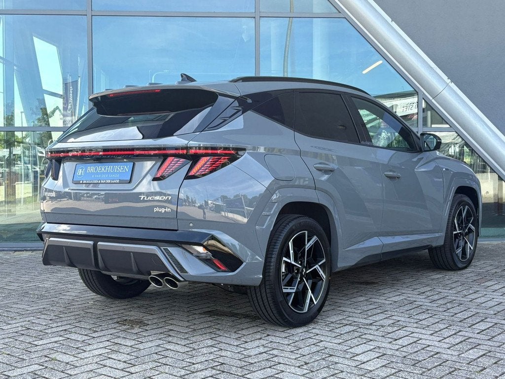 Hyundai Tucson 1.6 T-GDI PHEV N Line Sky 4WD 265pk FACELIFT, Auto's, Hyundai, Zwart, 4 cilinders, Adaptive Cruise Control, Bedrijf