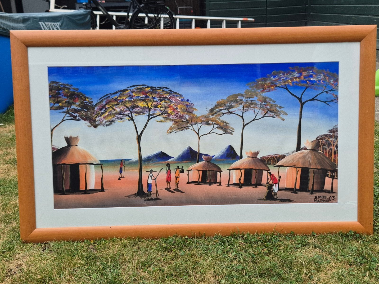 Afrikaans landschap schilderij met hutten en figuren, Ophalen