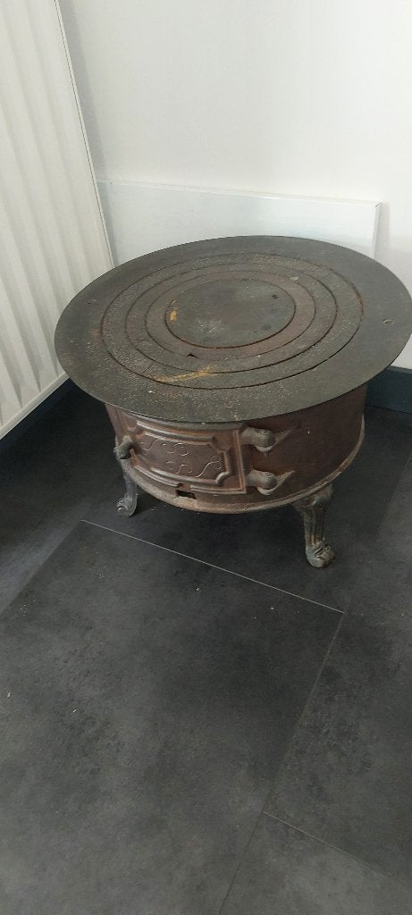 Antiek gietijzeren potkacheltje, Ophalen