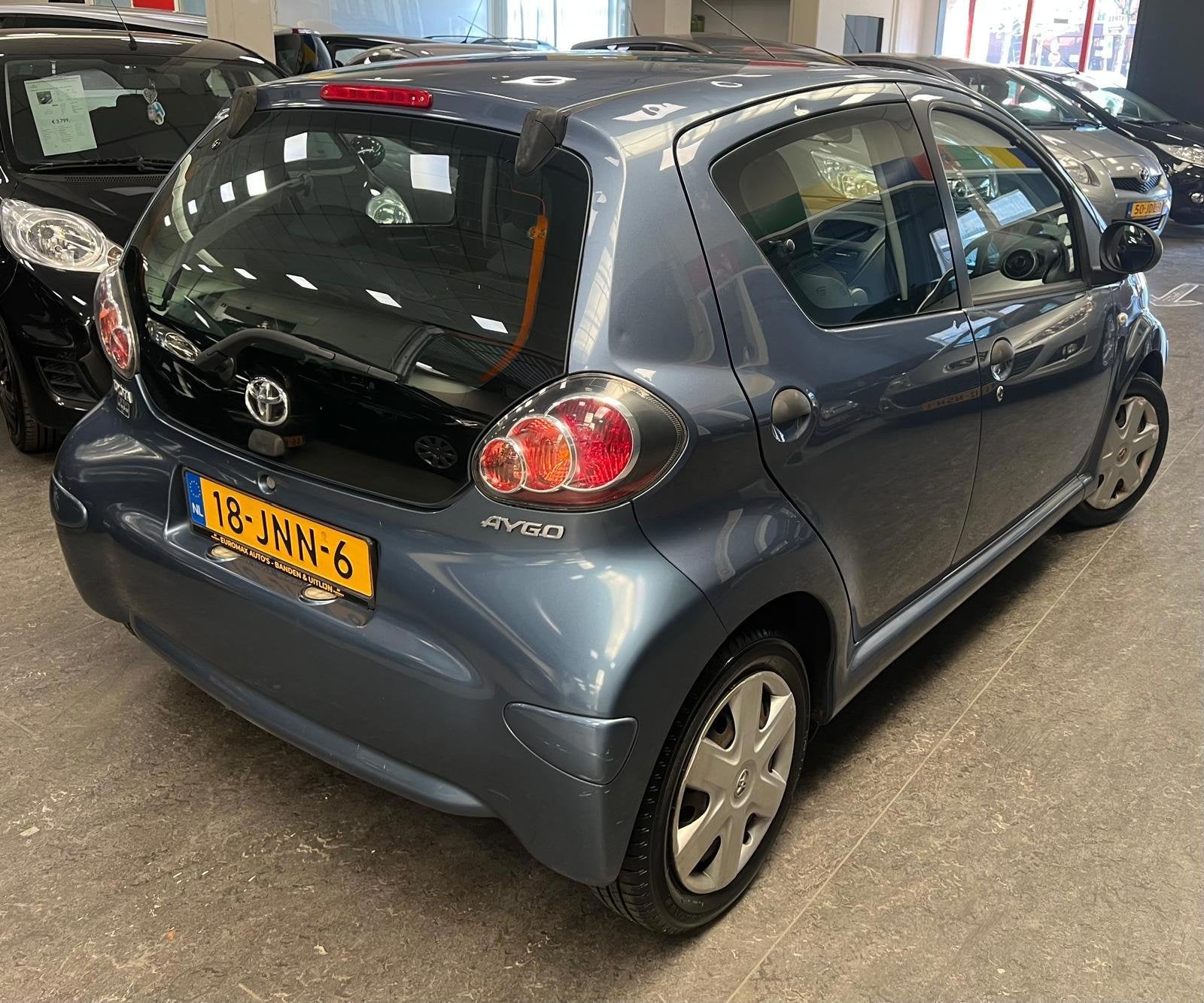 Toyota Aygo 1.0-12V Access 1e Eigenaar - NAP, Auto's, Voorwielaandrijving, Stof, Zwart, 68 pk