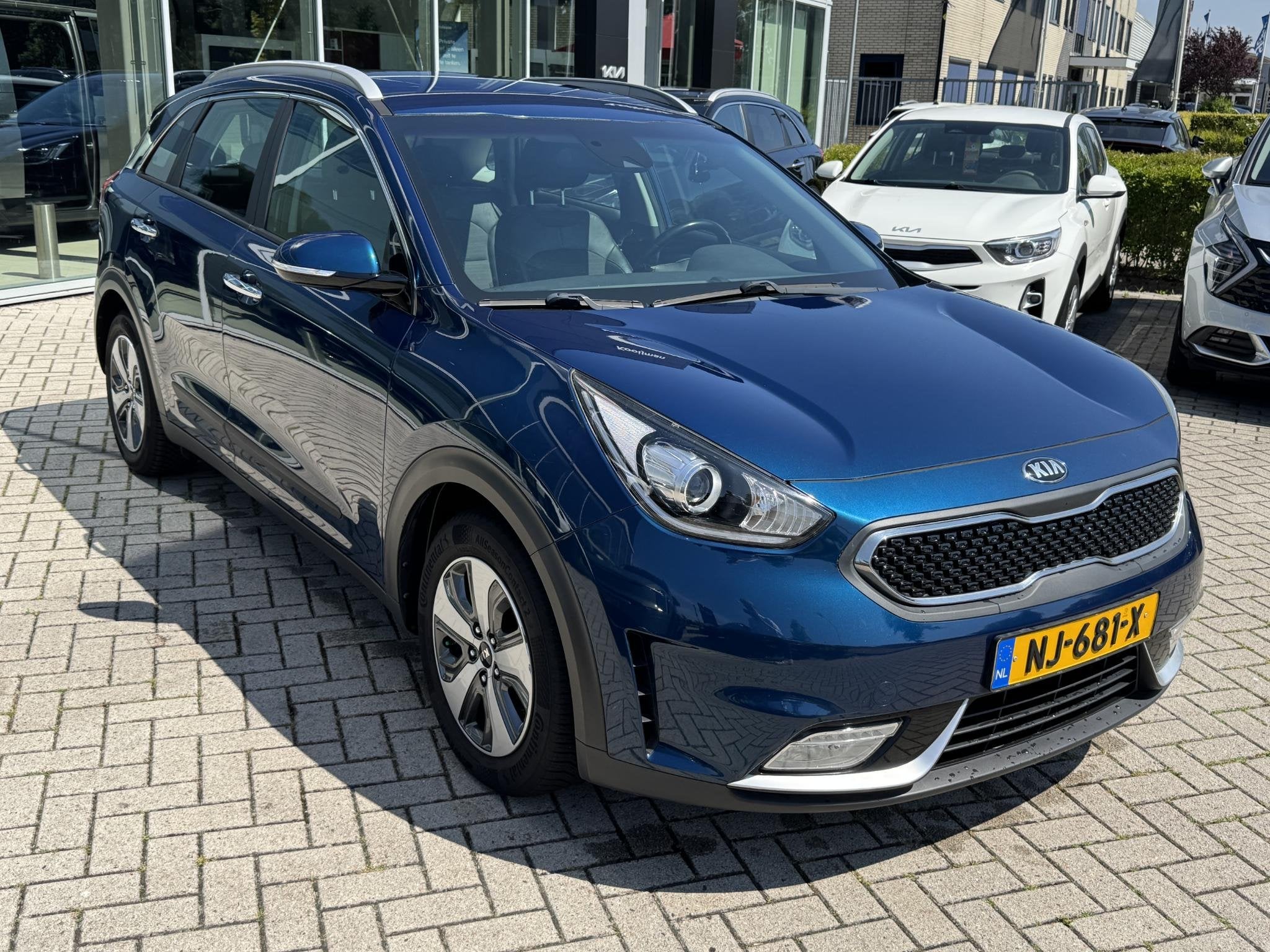 Kia Niro 1.6 GDi Hybrid First Edition, Auto's, Gebruikt, Euro 6, 2 kWh, Blauw
