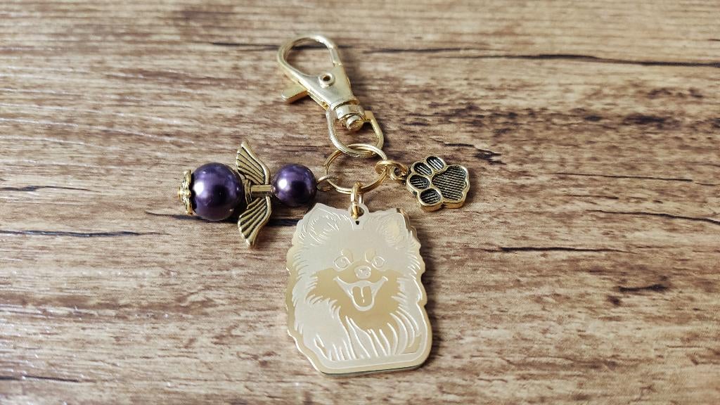 Sleutelhanger Pomeriaan RVS gold met beschermengeltje, Verzenden, Nieuw, Dier of Natuur