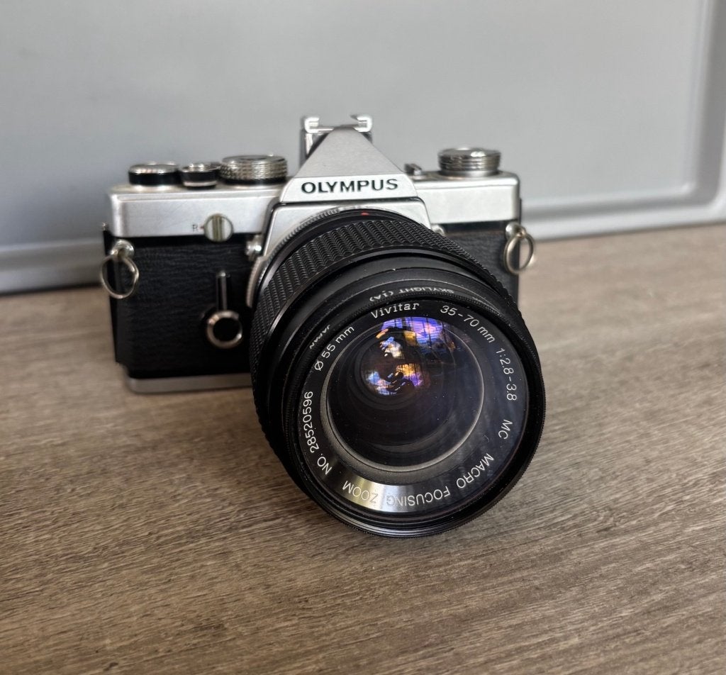 Olympus OM-1 Analoge camera + Vivitar 35-70mm f/2.8-3.8, Audio, Tv en Foto, Fotocamera's Analoog, Ophalen, Gebruikt, Spiegelreflex