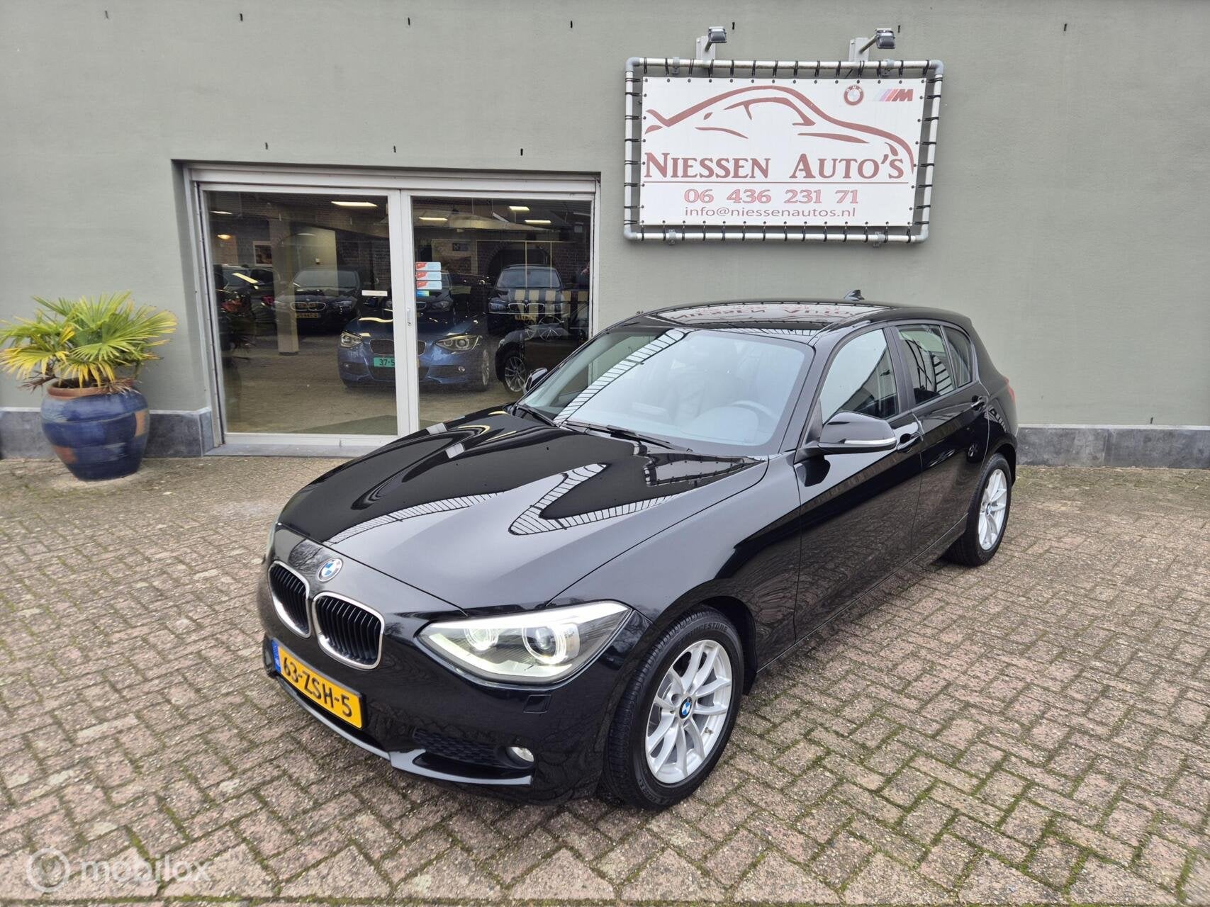BMW 1-serie F20 114i Business+ Leder/Led/Navi/Nwe Ketting, 1-Serie, Euro 5, Achterwielaandrijving, Zwart