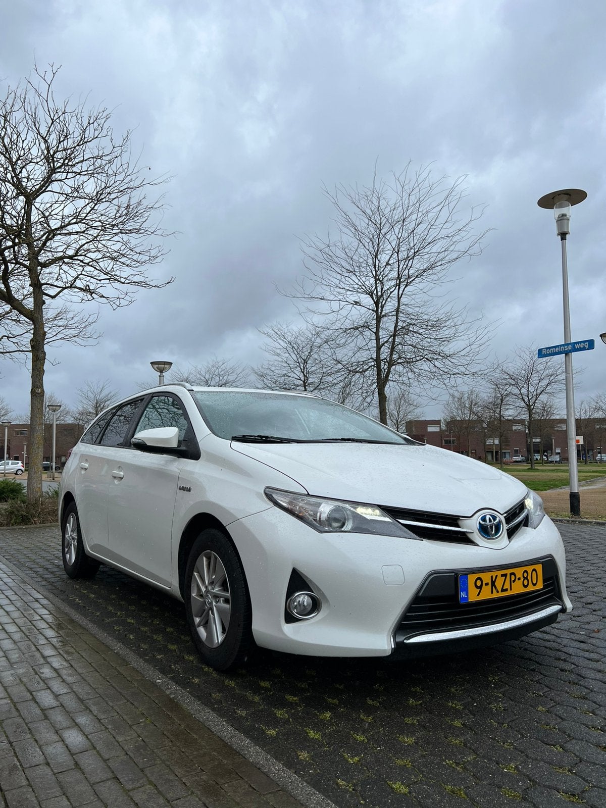 Toyota Auris 1.8 Hybrid Touring Sports CVT 2013 Wit, Auto's, Toyota, Stof, 1363 kg, Wit, Origineel Nederlands